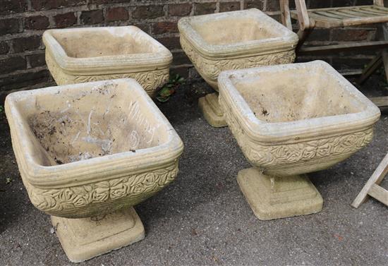 Set 4 stone planters on bases